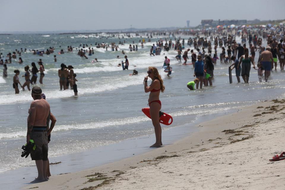 A lifeguard keeps watch at Hampton Beach on a hot summer day in July.