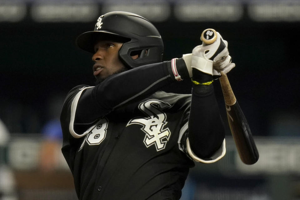 Chicago White Sox's Luis Robert hits a three-run home run during the seventh inning of a baseball game against the Kansas City Royals at Kauffman Stadium in Kansas City, Mo., Thursday, Sept. 3, 2020. (AP Photo/Orlin Wagner)