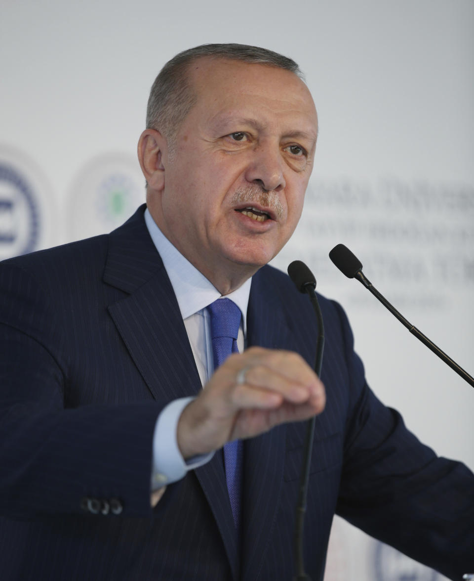 Turkey's President Recep Tayyip Erdogan speaks during the ground-breaking of Marmara University's Recep Tayyip Erdogan complex, in Istanbul, Friday, Nov. 29, 2019. Erdogan slammed French President Emmanuel Macron Friday for his comments on NATO and Turkey's membership. "You should get checked whether you're brain-dead," Erdogan called out to Macron.( Presidential Press Service via AP, Pool ) .