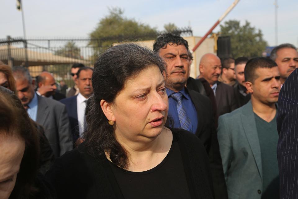 Noorah al-Gailani, center, attends her mother's funeral in Baghdad, Iraq, Monday, Jan. 21, 2019. Iraq is mourning the loss of Lamia al-Gailani, a beloved archaeologist who helped rebuild her country's leading museum in the aftermath of the U.S. invasion in 2003. (AP Photo/Khalid Mohammed)