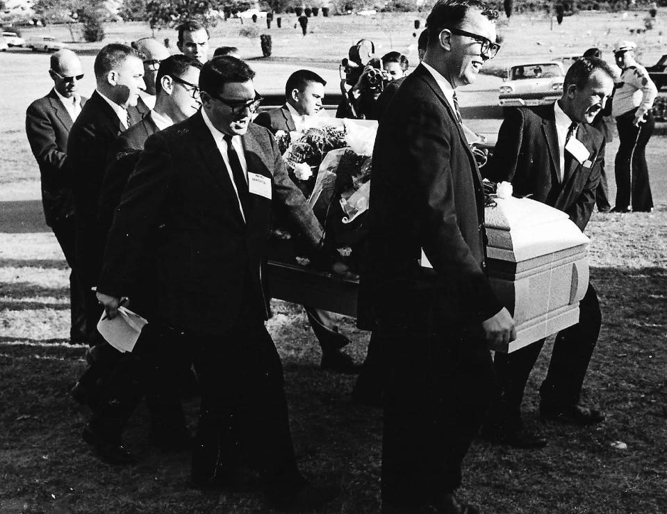 Mike Cochran, middle, helps carry the casket of Lee Harvey Oswald, the accused assassin of President John F. Kennedy. Reporters carried the casket when others would not. Oswald was shot to death by Jack Ruby on Nov. 24, 1963. He was buried in Rose Hill Cemetery in Fort Worth.