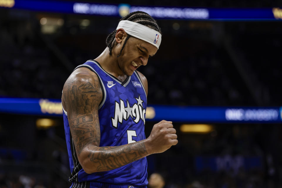 Orlando Magic forward Paolo Banchero reacts to play against the Milwaukee Bucks during the second half of an NBA basketball game Saturday, Nov. 11, 2023, in Orlando, Fla. (AP Photo/Kevin Kolczynski)