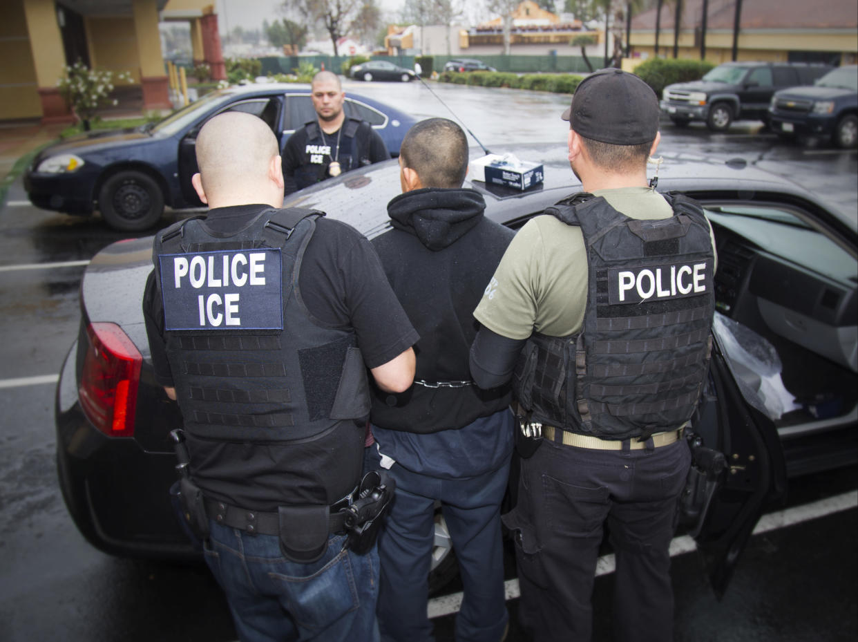 U.S. Immigration and Customs Enforcement agents conduct a raid in Southern California