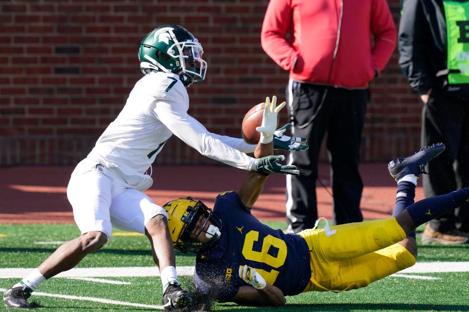 Michigan State Spartans receiver Ricky White makes a catch against Michigan Wolverines cornerback Jalen Perry during the fourth quarter Saturday, Oct. 31, 2020, in Ann Arbor.