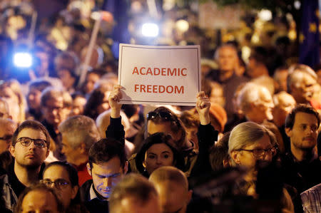 People attend a rally outside George Soros's Central European University to protest against the university being forced out of Budapest by Prime Minister Viktor Orban's government in Budapest, Hungary, October 26, 2018. REUTERS/Bernadett Szabo