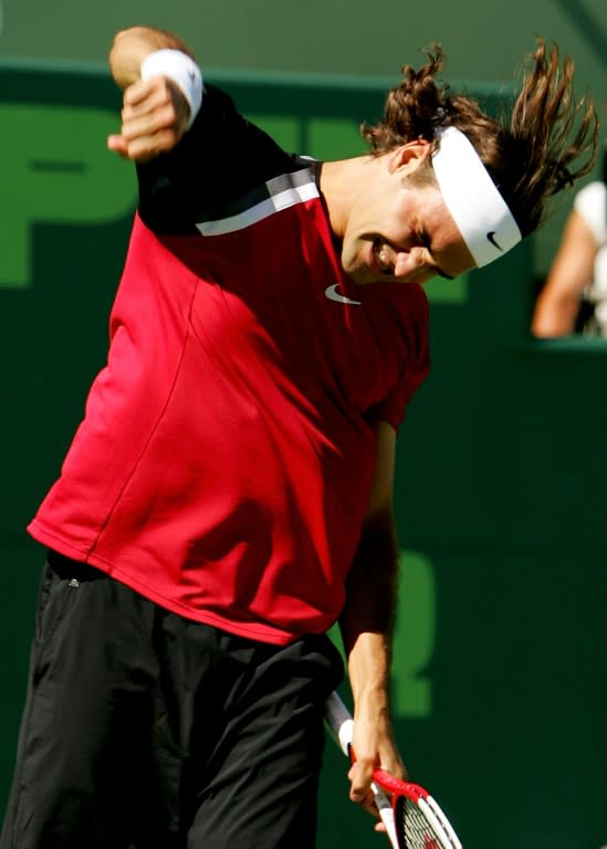 Roger Federer of Switzerland celebrates defeating Rafael Nadal of Spain in the men's final of the NASDAQ-100 Open at the Crandon Park Tennis Center in Key Biscayne, Florida on April 3, 2005