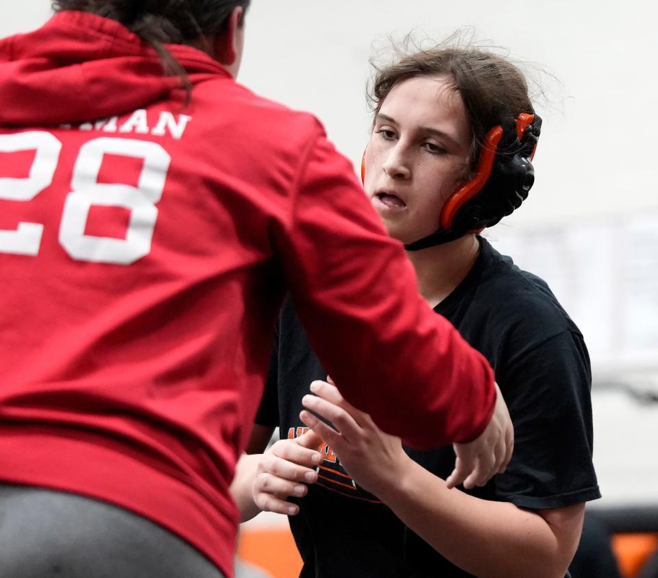 Delaware Hayes wrestler Evelyn Krauss spars with a teammate in practice on Wednesday.