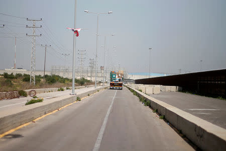 A truck carrying crates containing animals leaves Gaza after the animals were taken out of a Gaza zoo by FOUR PAWS organization, at Israeli Erez crossing in the northern Gaza Strip April 7, 2019. REUTERS/Mohammed Salem