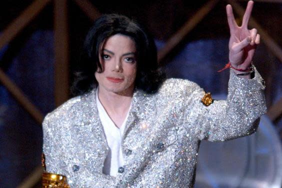Michael Jackson accepts his Performer of the Century Award during the 29th Annual American Music Awards at the Shrine Auditorium on 9 January, 2002 in Los Angeles, California. (Vince Bucci/Getty Images)