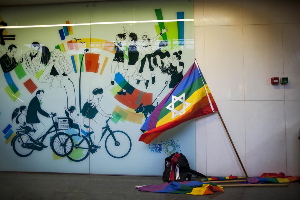 In this Wednesday, Jan. 11, 2012 photo, a rainbow flag with a Star of David is placed at the entrance to the municipality building in Tel Aviv, Israel. Thanks to a balmy climate, a vibrant nightlife and a creative, government-backed branding campaign, Tel Aviv has become one of the world's top gay tourist destinations. (AP Photo/Oded Balilty)