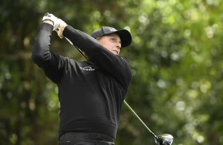 Apr 6, 2017; Augusta, GA, USA; Phil Mickelson hits his tee shot on the 2nd hole during the first round of The Masters golf tournament at Augusta National Golf Club. Mandatory Credit: Michael Madrid-USA TODAY Sports