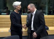 International Monetary Fund Managing Director Christine Lagarde (L) shakes hands with Greek Finance Minister Yanis Varoufakis (R) during a Eurozone finance ministers emergency meeting on the situation in Greece in Brussels, Belgium June 25, 2015. REUTERS/Philippe Wojazer