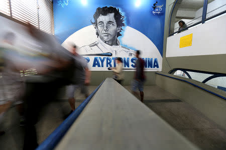 Brazilians arrive at the Ayrton Senna school set up as a polling station to cast their votes in the presidential election, in Rio de Janeiro, Brazil October 7, 2018. REUTERS/Sergio Moraes