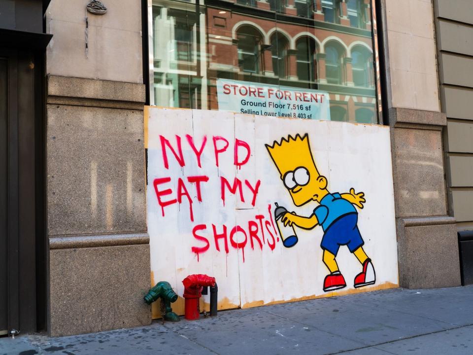 Street art featuring the character Bart Simpson is on display on a boarded-up building in SoHo on June 21, 2020 in New York City.