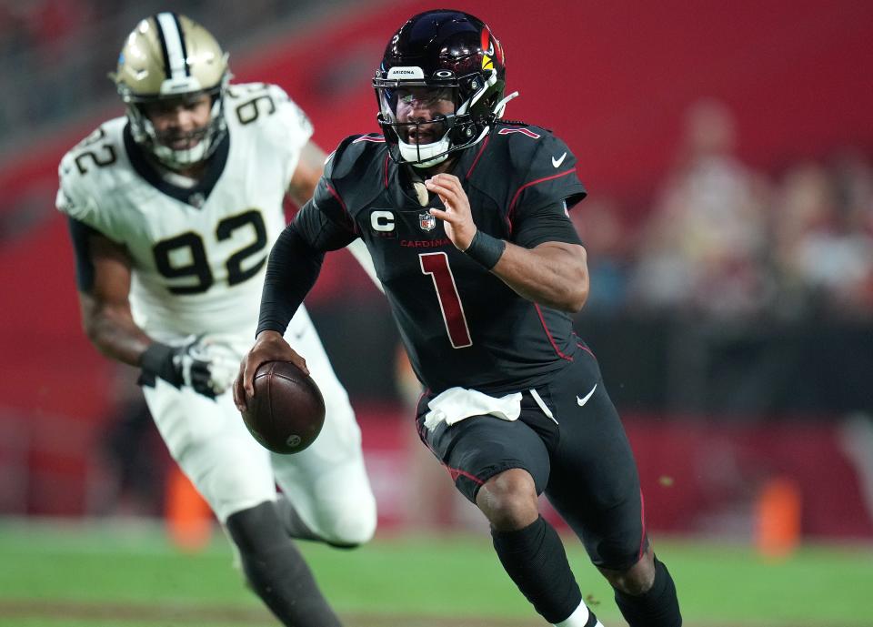Oct 20, 2022; Glendale, Arizona, United States; Arizona Cardinals quarterback Kyler Murray (1) scrambles for a first down against the New Orleans Saints at State Farm Stadium.
