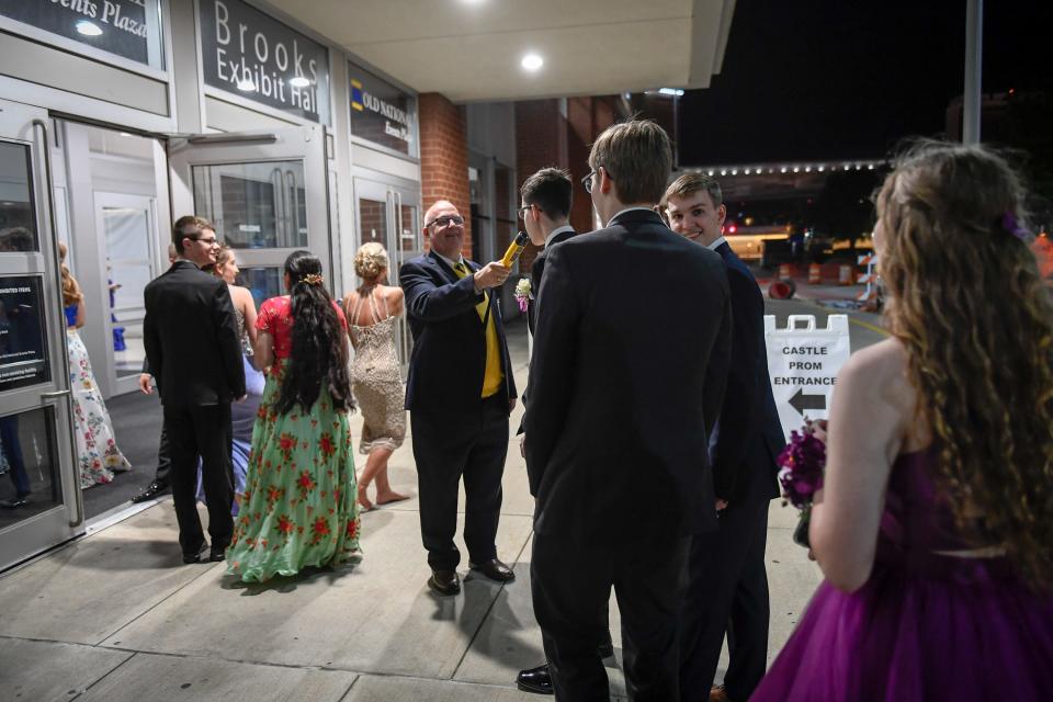 Richard Lance uses a breathalyzer to check couples entering the Castle High School prom, held at the Old National Events Center Plaza in Evansville, Indiana, Saturday, April 27, 2019.