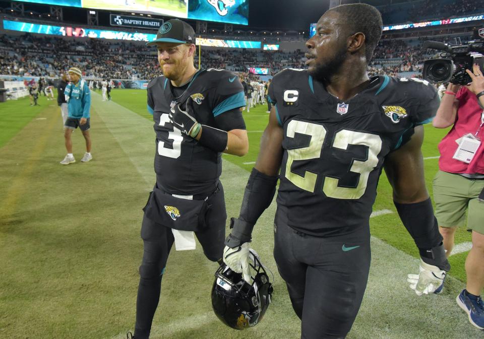 Jacksonville Jaguars back-up quarterback C.J. Beathard (3) and linebacker Foyesade Oluokun (23) leave the field after Monday night's loss to the Bengals. Beathard played in the game after Jaguars starting quarterback Trevor Lawrence (16) went out of the game with an ankle injury. The Jacksonville Jaguars hosted the Cincinnati Bengals at EverBank Stadium in Jacksonville, Florida for Monday Night Football, December 4, 2023. The Jaguars were tied 14 to 14 at the end of the first half an fell in overtime with a final score of 34 to 31. [Bob Self/Florida Times-Union]