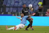 Lazio's Taty Castellanos, left, challenges for the ball with Juventus' Bremer during the Serie A soccer match between Lazio and Juventus at Rome's Olympic Stadium, Saturday, March 30, 2024. (AP Photo/Andrew Medichini)