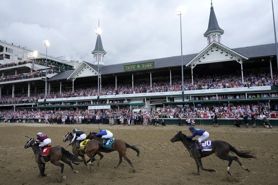 Horses run in the 148th running of the Kentucky Oaks horse race at Churchill Downs Friday, May 6, 2022, in Louisville, Ky. (AP Photo/Jeff Roberson)