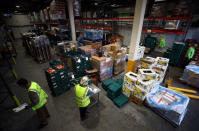 Volunteers sort and check food quality at the FareShare food redistribution centre in Deptford, as the spread of the coronavirus disease (COVID-19) continues, in south east London