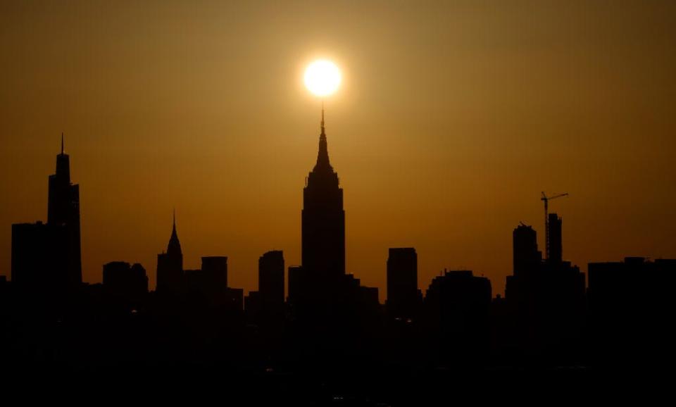 Sunrise on the day of the solar eclipse. The sun appears to be at the tip of the Empire State Building