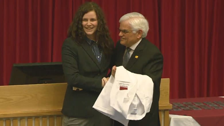 Slain pharmacist honoured by MUN for decades of service, daughter accepts award on behalf