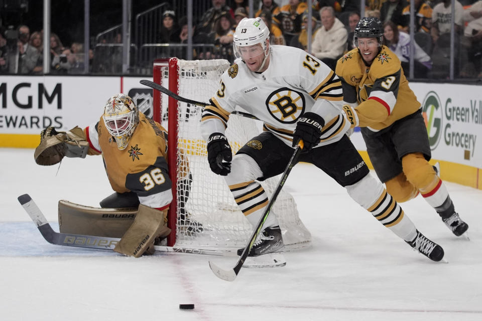 Boston Bruins center Charlie Coyle (13) skates around the net against the Vegas Golden Knights during the third period of an NHL hockey game Thursday, Jan. 11, 2024, in Las Vegas. (AP Photo/John Locher)