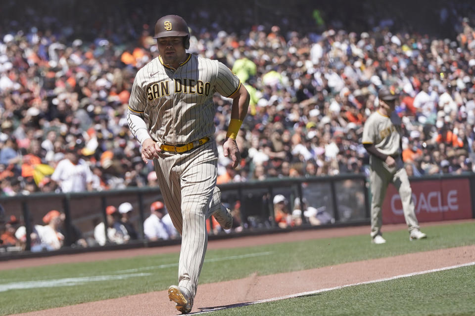 San Diego Padres' Luke Voit runs home to score against the San Francisco Giants during the sixth inning of a baseball game in San Francisco, Saturday, May 21, 2022. (AP Photo/Jeff Chiu)