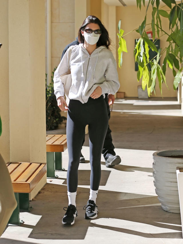 Kendall Jenner Gets Active in Gray Hoodie, Black Stretch Pants and Nike  Sneakers for Pilates - Yahoo Sports