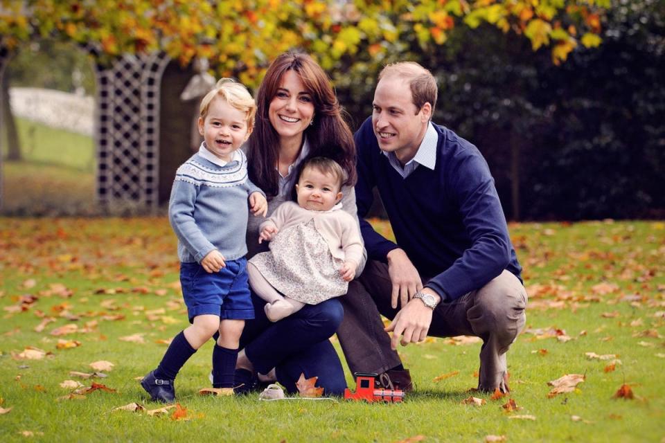 The Duke and Duchess of Cambridge with their two children, Prince George and Princess Charlotte, in a photograph taken late October 2015 at Kensington Palace in London. (PA)