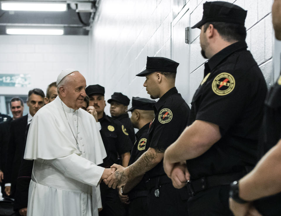 PHILADELPHIA, PA - SEPTEMBER 27: Pope Francis greets corrections officers during a visit to the Curran-Fromhold Correction Facility September 27, 015 in in Philadelphia, Pennsylvania.