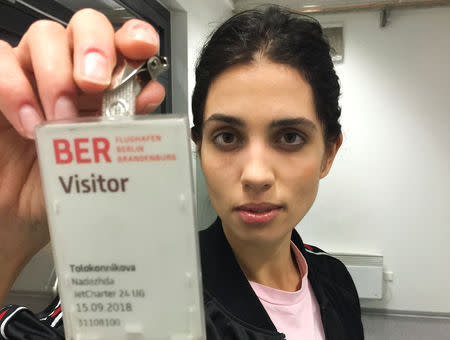 Nadezhda Tolokonnikova, a Pussy Riot member and wife of anti-Kremlin activist Pyotr Verzilov shows her access pass while waiting for the arrival of a special medical plane carrying her husband at Schoenefeld airport in Berlin, Germany September 15, 2018. Cinemaforpeace/Handout via REUTERS