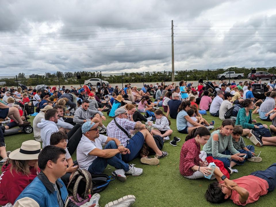 Crowds at Kennedy Space Center Visitor Complex wait for the historic final launch of the Delta IV Heavy rocket.