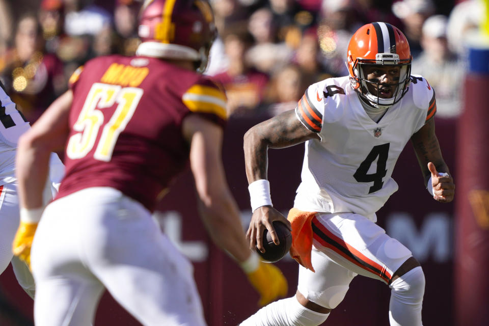 Cleveland Browns quarterback Deshaun Watson (4) scrambles out of the pocket during the first half of an NFL football game against the Washington Commanders, Sunday, Jan. 1, 2023, in Landover, Md. (AP Photo/Susan Walsh)