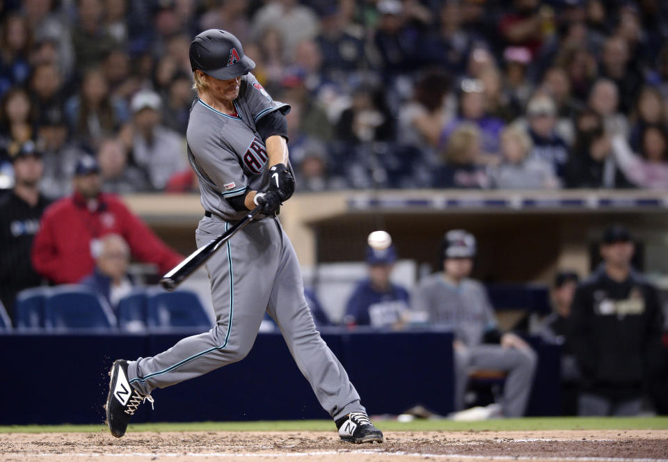 FILE - In this April 2, 2019, file photo, Arizona Diamondbacks pitcher Zack Greinke hits a three-run home run during the fourth inning of a baseball game against the San Diego Padres in San Diego. While pitchers have always been viewed as the weakest link in the batting order, there was a time when they weren't automatic outs. (AP Photo/Orlando Ramirez, File)