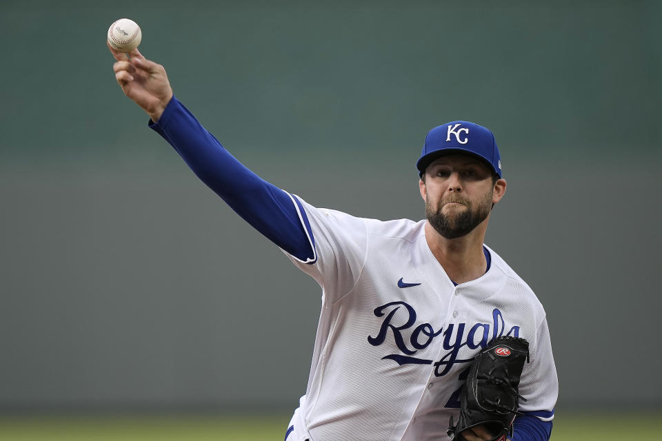 Kansas City Royals starting pitcher Jordan Lyles throws during the first inning of a baseball game against the Cincinnati Reds Tuesday, June 13, 2023, in Kansas City, Mo. (AP Photo/Charlie Riedel)