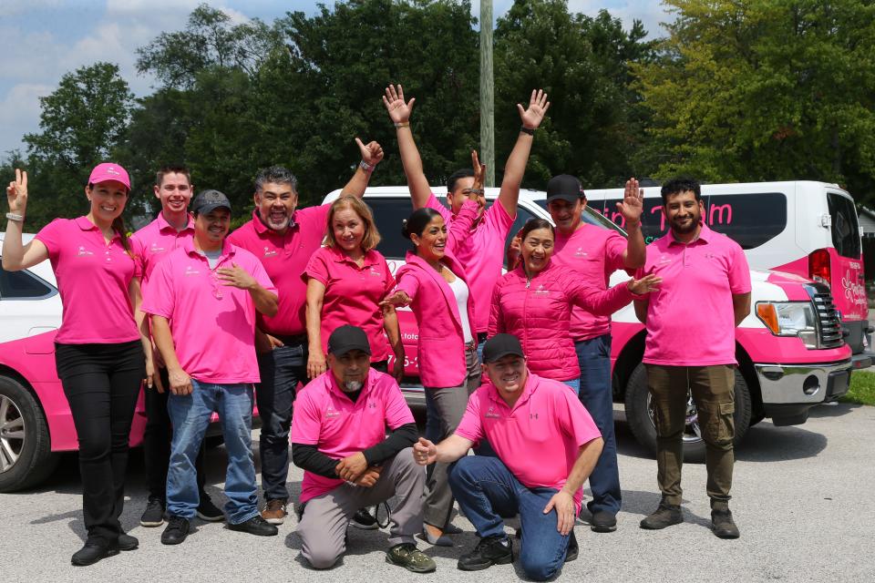 Pink Team Cleaning Services team members take a new photo for social media, on Friday, Aug. 18, 2023, in Lafayette Ind.