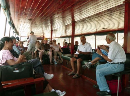 Tourists enjoy the ride on board the "Islamorada" boat in Panama City on April 15. For $165 for a full 50-mile (80 kilometer) trip or $115 for a shorter version, visitors get to go through the canal, but are also transported back to a time when the boat supplied an underground world, shipping black market booze back to the hidden speakeasies of Capone's Chicago