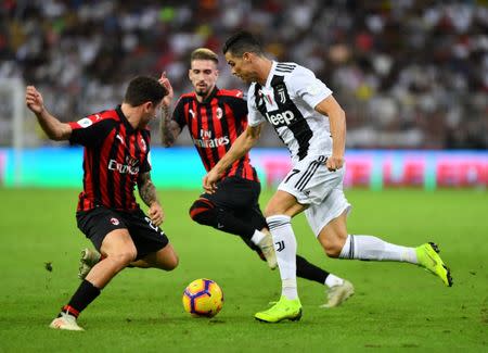 Soccer Football - Italian Super Cup - Juventus v AC Milan - King Abdullah Sports City, Jeddah, Saudi Arabia - January 16, 2019 Juventus' Cristiano Ronaldo in action with AC Milan's Samu Castillejo REUTERS/Waleed Ali