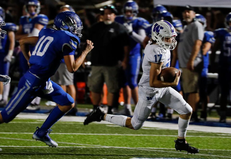 Walled Lake Western wide receiver Jaxon Lippert (17) runs against White Lake Lakeland during the second half of Walled Lake Western's 52-7 win in White Lake on Friday, Sept. 9, 2022.