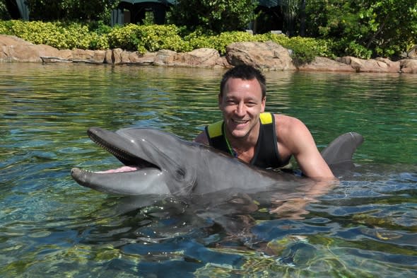 John Terry goes swimming with dolphins in Florida