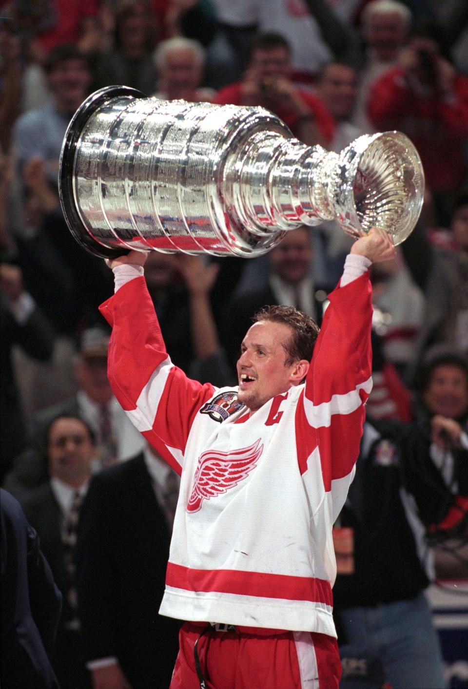 Steve Yzerman hoists the Stanley Cup after the Red Wings beat the Philadelphia Flyers on June 7, 1997 at Joe Louis Arena.  