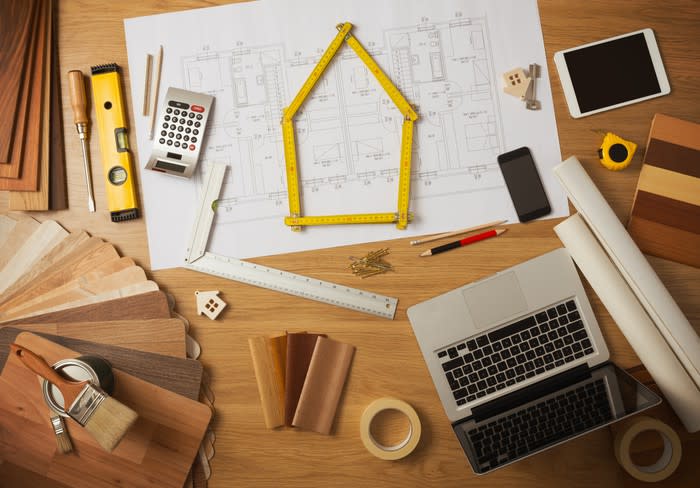 A number of home improvement tools spread out across a table.