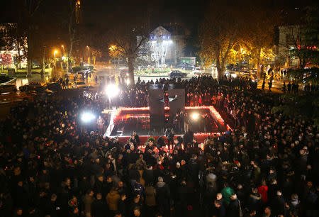 Bosnian Croats pray and light candles for the convicted general Slobodan Praljak, who killed himself seconds after the verdict in the U.N. war crimes tribunal in The Hague, in Mostar, Bosnia and Herzegovina November 29, 2017. REUTERS/Dado Ruvic