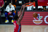 Philadelphia 76ers center Joel Embiid (21) gets a dunk against the Washington Wizards during the second half of an NBA basketball game Wednesday, Aug. 5, 2020 in Lake Buena Vista, Fla. (AP Photo/Ashley Landis)