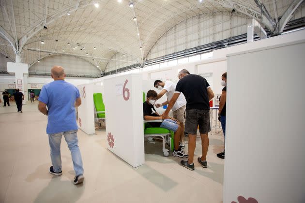 BARI, ITALY - AUGUST 07: People get vaccinated inside the hub on August 07, 2021 in Bari, Italy. The hub of the Fiera del Levante, has facilitated thousands of vaccinations during the vaccination campaign of the Bari ASL to ensure first and second doses are delivered to the population over the age of 12.  (Photo by Donato Fasano/Getty Images) (Photo: Donato Fasano via Getty Images)