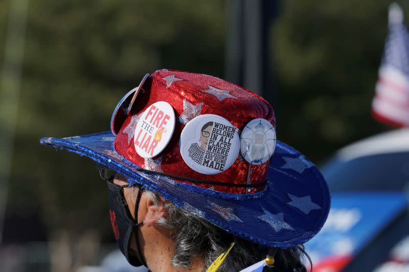 FILE PHOTO: Sara Lopez wears a hat with pins at a campaign event held by U.S. Democratic vice presidential nominee Senator Kamala Harris in Edinburg, Texas