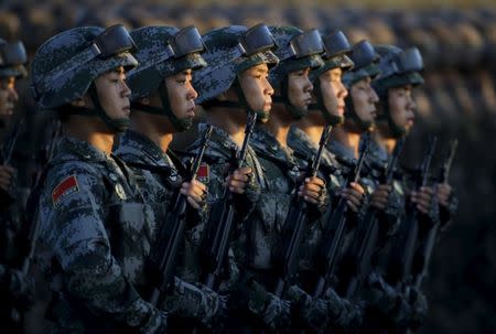 Soldiers of China's People Liberation Army (PLA) prepare in front of the Tiananmen Gate ahead of the military parade to mark the 70th anniversary of the end of World War Two, in Beijing, China, September 3, 2015. REUTERS/Jason Lee