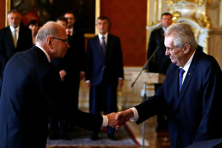 Czech Republic's President Milos Zeman (R) appoints Ivan Pilny as the new Finance Minister at Prague Castle in Prague, Czech Republic, May 24, 2017. REUTERS/David W Cerny