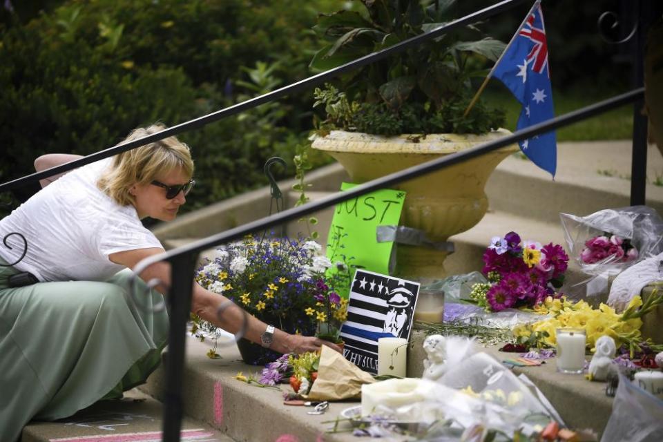 Flowers are placed at a memorial for Justine Damond on the steps of the Lake Harriet Spiritual Community church in south Minneapolis.